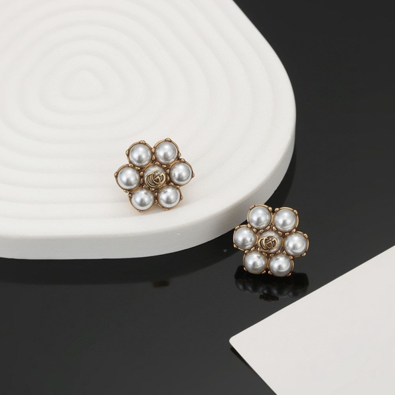 G*u*i earrings